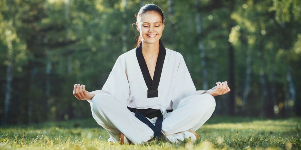 Martial Arts Lessons for Adults in Broomfield CO - Happy Woman Meditated Sitting Background